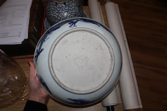 A Chinese blue and white deep plate decorated with a dragon and two other items